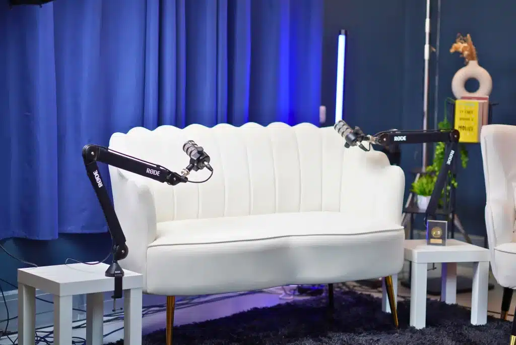 Professional 4-person guest seating area at NextMedia London podcast studio.