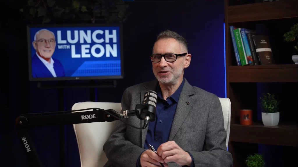 A business guest recording a professional interview during a podcast studio hire session.